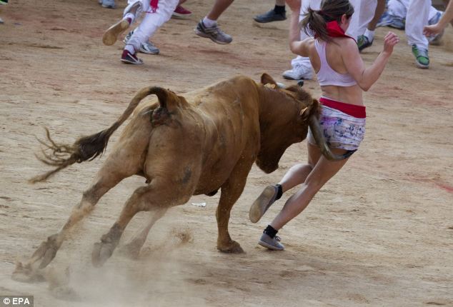 Girl in running with the bulls